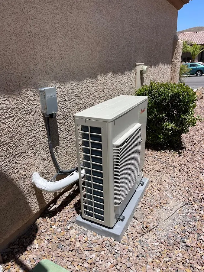Residential air conditioning condenser unit in Applewood